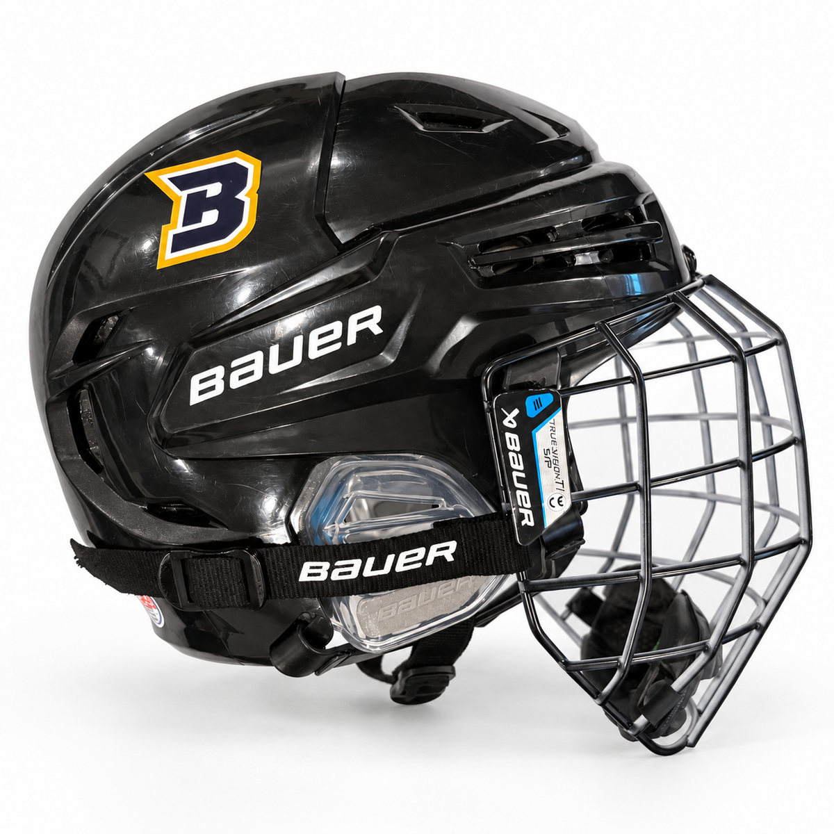 Braves hockey helmet decals on black Bauer helmet