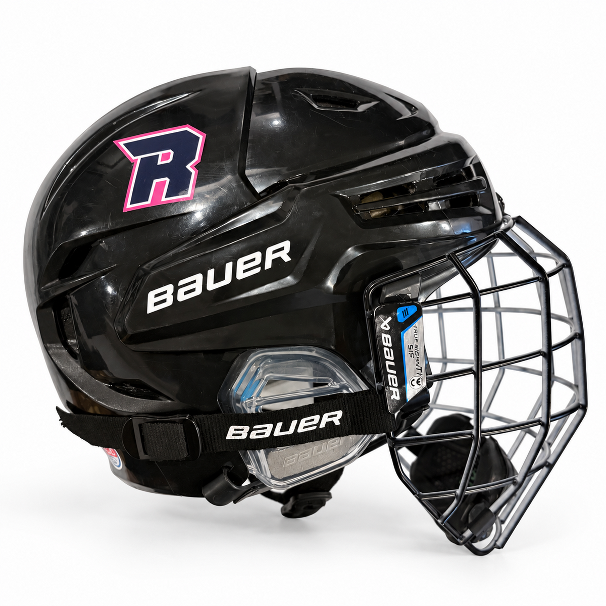 Rockettes hockey helmet decals on a black Bauer helmet